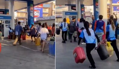 Tayland’da yakıt krizi nedeniyle insanlar ellerinde bidonlarla petrollere akın etti